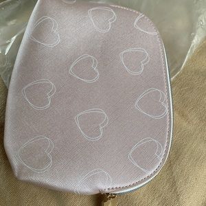 small pink makeup bag from Pandora